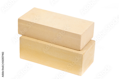 Two yellow ceramic bricks at the white background, isolated