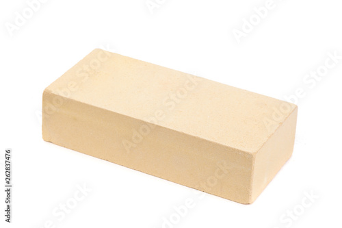 Yellow ceramic brick at the white background, isolated