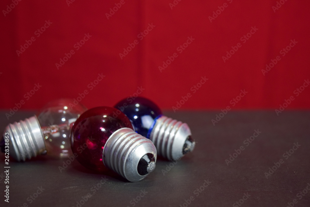 Close up lamp in red background and black table Close up lamp in red background and black table