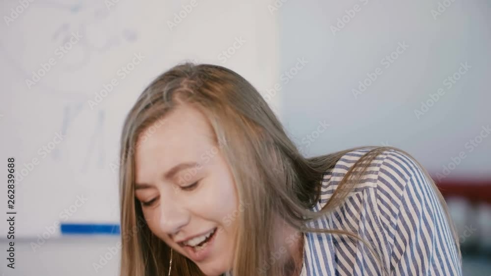 Young confident successful company boss business woman talking, leading office meeting in modern light office space. Young confident successful company boss business woman talking, leading office meeting in modern light office space.