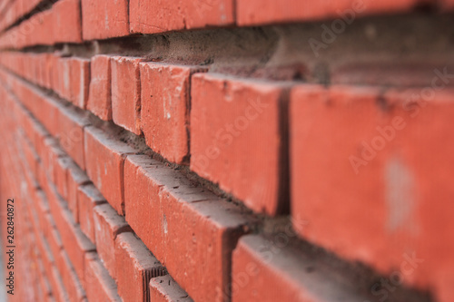 red brick wall in perspective. selective focus