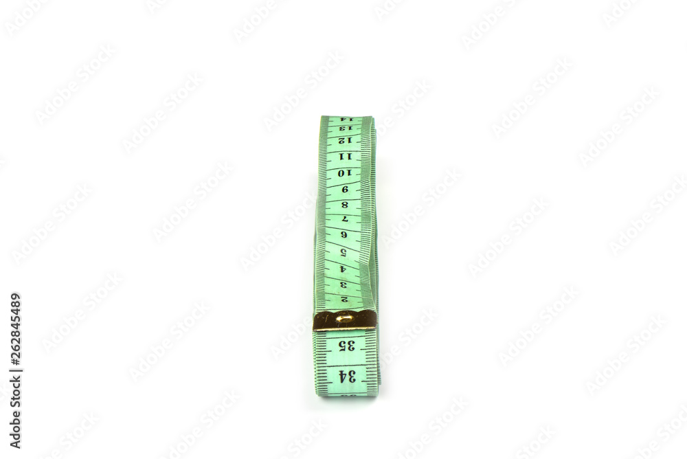 Tailoring centimeter tape twisted into a spiral isolated on a white background. Tailoring centimeter tape twisted into a spiral isolated on a white background.