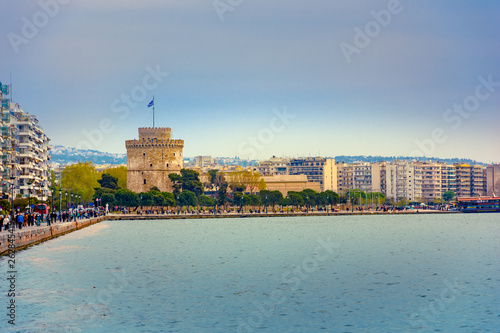 View of the White Tower of Thessaloniki which is a monument and museum on the waterfront of Thessaloniki, capital of the region of Macedonia in northern Greece