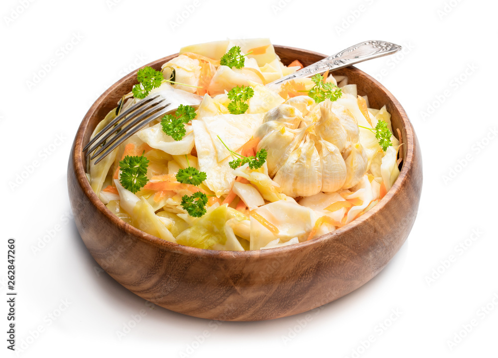 Homemade marinated cabbage with garlic isolated on a white Homemade marinated cabbage with garlic isolated on a white