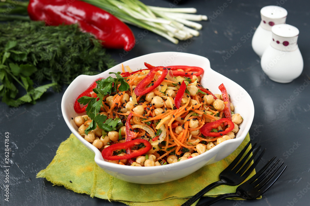 Healthy chickpea, Korean carrot, pepper and onion salad decorated with black sesame Healthy chickpea, Korean carrot, pepper and onion salad decorated with black sesame