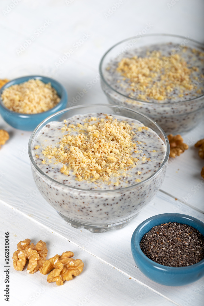 Chia pudding made with milk, banana and decorated with walnut Chia pudding made with milk, banana and decorated with walnut