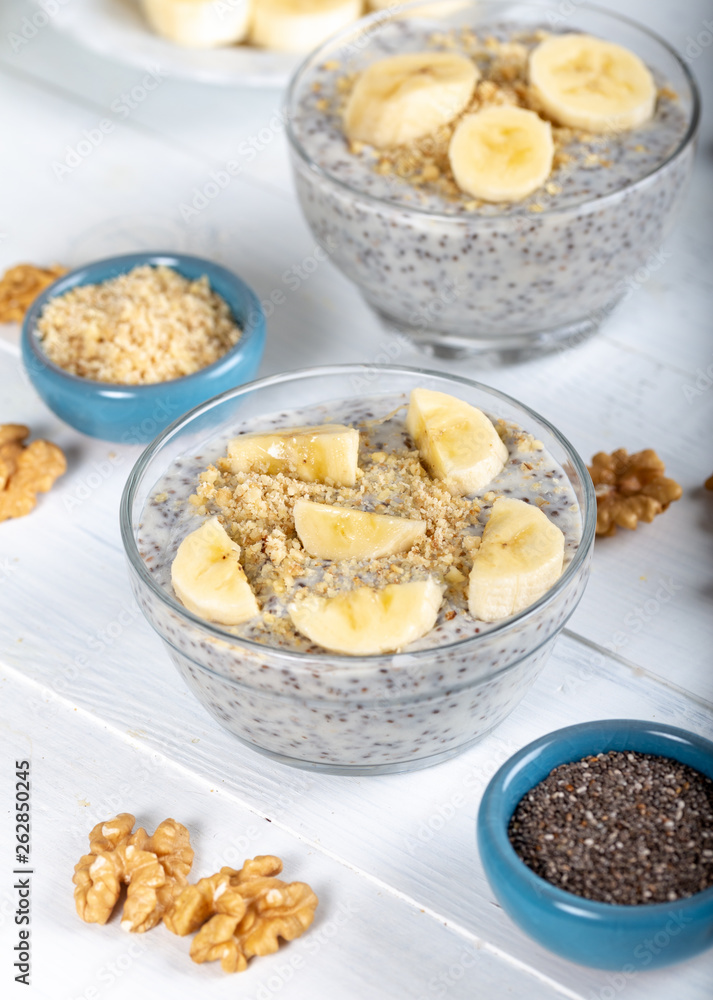 Chia pudding made with milk, banana and decorated with walnut Chia pudding made with milk, banana and decorated with walnut