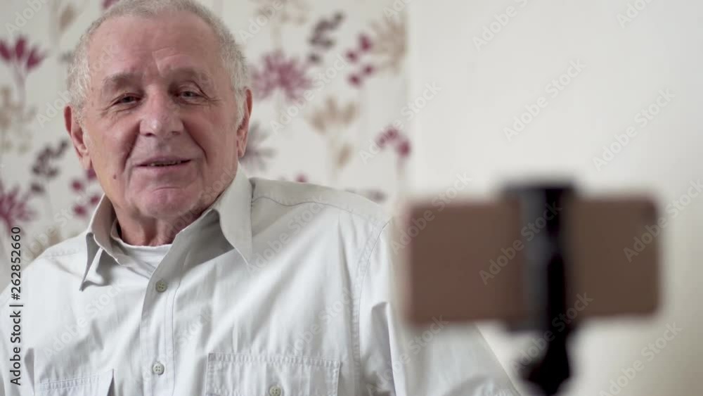 Fashion senior man making video vlog with smartphone Fashion senior man making video vlog with smartphone