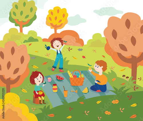 Children friends at picnic outdoors in autumn park or garden with colorful tree leaves.