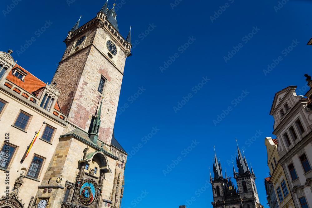 The Prague Astronomical Clock or Orloj in the south wall of the Old Town Hall tower. In the background the Týn Church. Postcard of Prague. Prague, Czech Republic