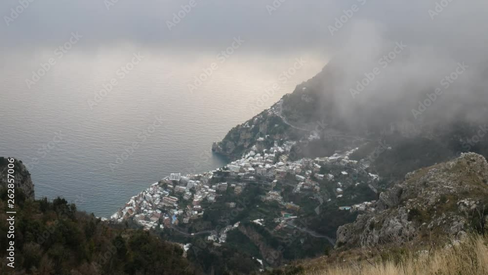 Panorama of Positano in nthe fog seen from the Lattari mountains. Amalfi Coast, Campania, Italy Panorama of Positano in nthe fog seen from the Lattari mountains. Amalfi Coast, Campania, Italy