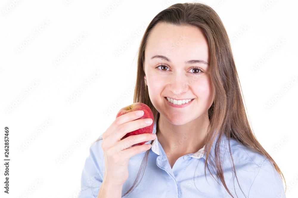 Portrait of cheerful young woman eating red apple with copy space Portrait of cheerful young woman eating red apple with copy space