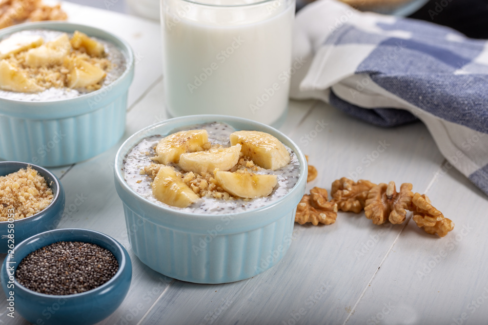 Chia pudding made with milk, banana and decorated with walnut Chia pudding made with milk, banana and decorated with walnut