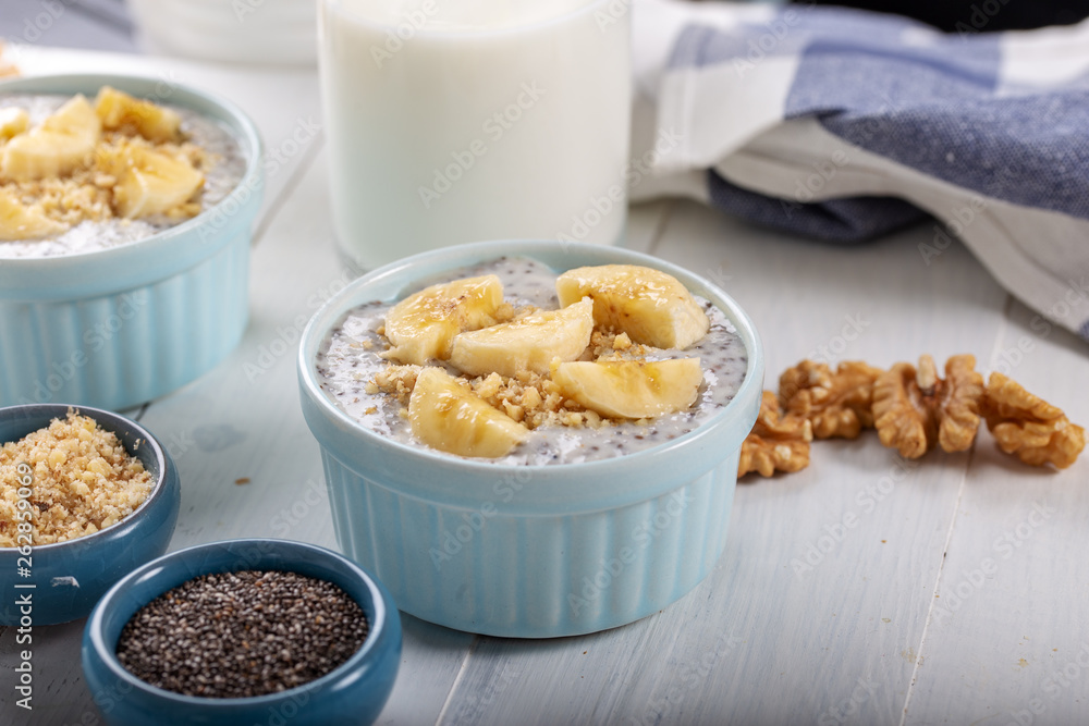 Chia pudding made with milk, banana and decorated with walnut Chia pudding made with milk, banana and decorated with walnut