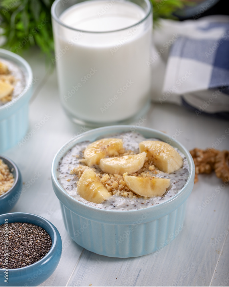 Chia pudding made with milk, banana and decorated with walnut Chia pudding made with milk, banana and decorated with walnut