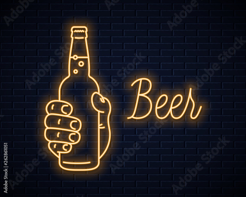 Hand hold beer bottle neon sign. Male hand beer