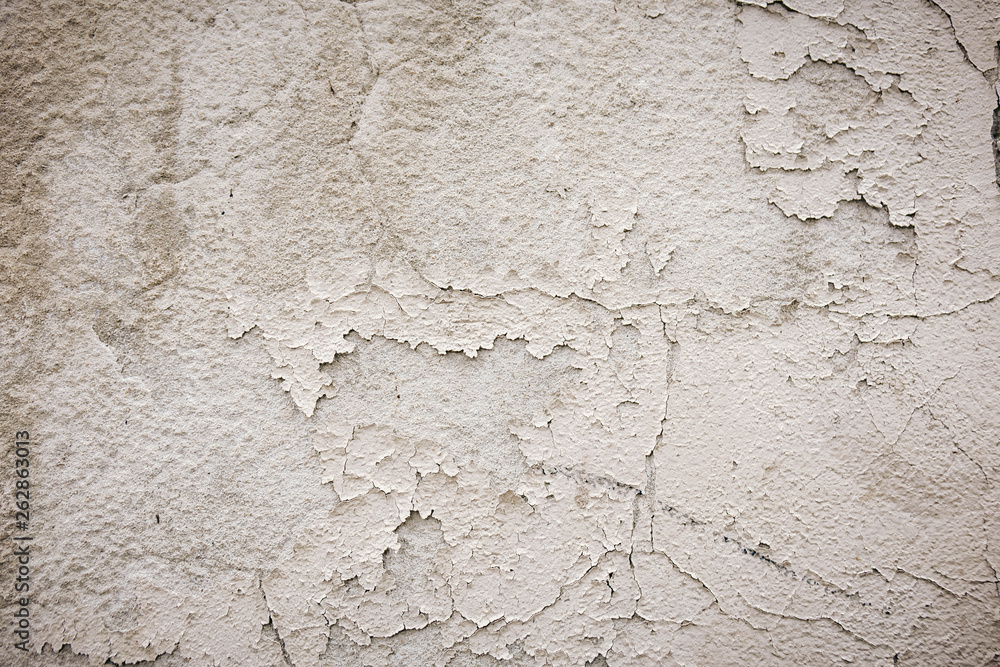 Gray cement wall with traces of the brush on the crumbling plaster. textural composition Gray cement wall with traces of the brush on the crumbling plaster. textural composition