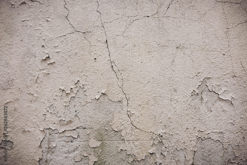 Gray cement wall with traces of the brush on the crumbling plaster. textural composition Gray cement wall with traces of the brush on the crumbling plaster. textural composition