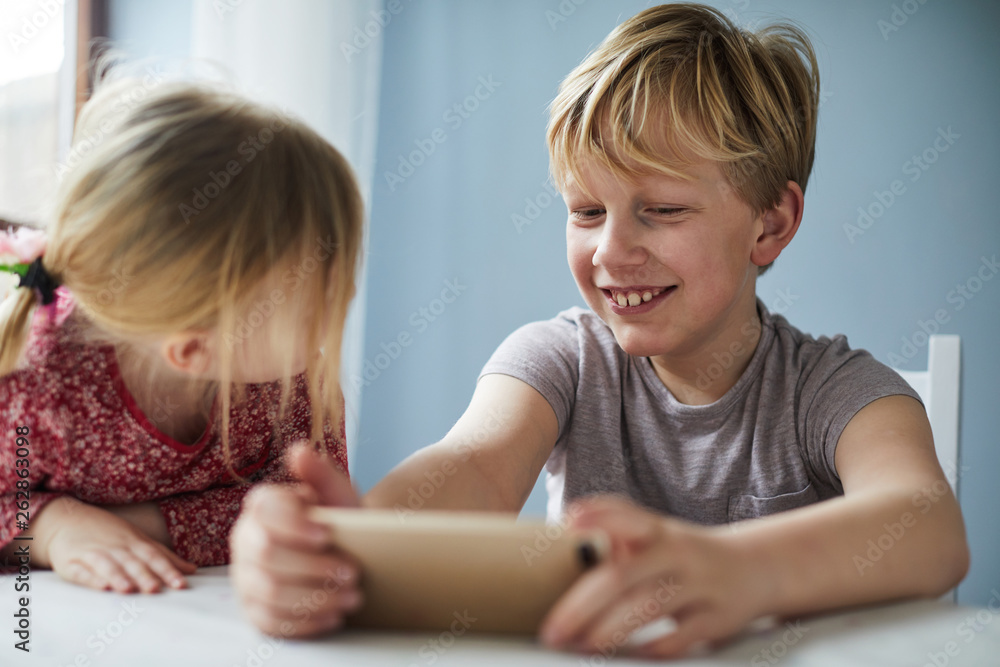 Children playing on smartphone together Children playing on smartphone together