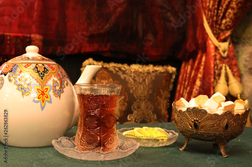 Azerbaijan tea in a glass armudu. Tea with lemon