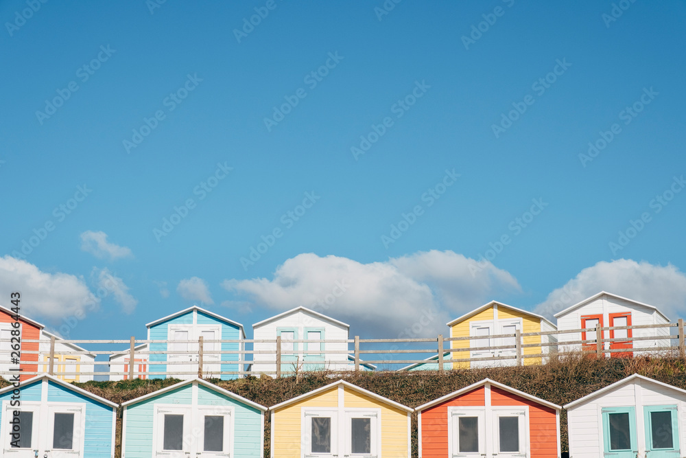 Colourful beach huts on the seafront. Bude, Cornwall, UK. Colourful beach huts on the seafront. Bude, Cornwall, UK.
