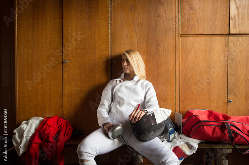 Female fencer in locker room.