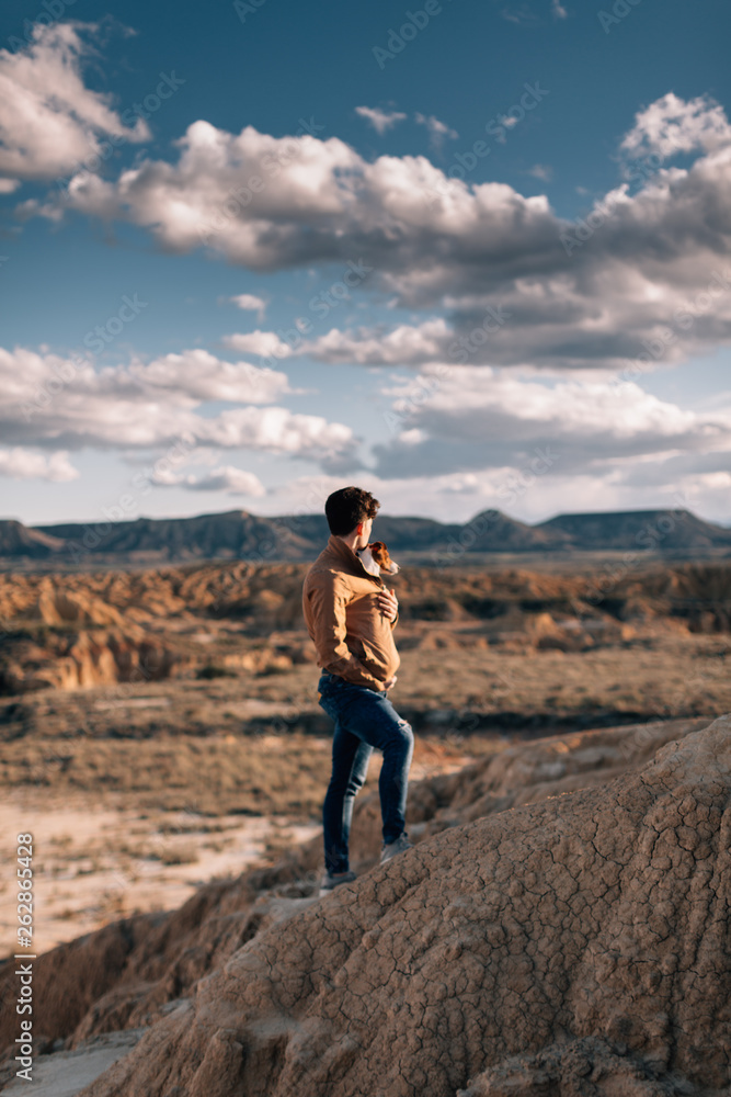 Boy with his dog walking at desert. Boy with his dog walking at desert.