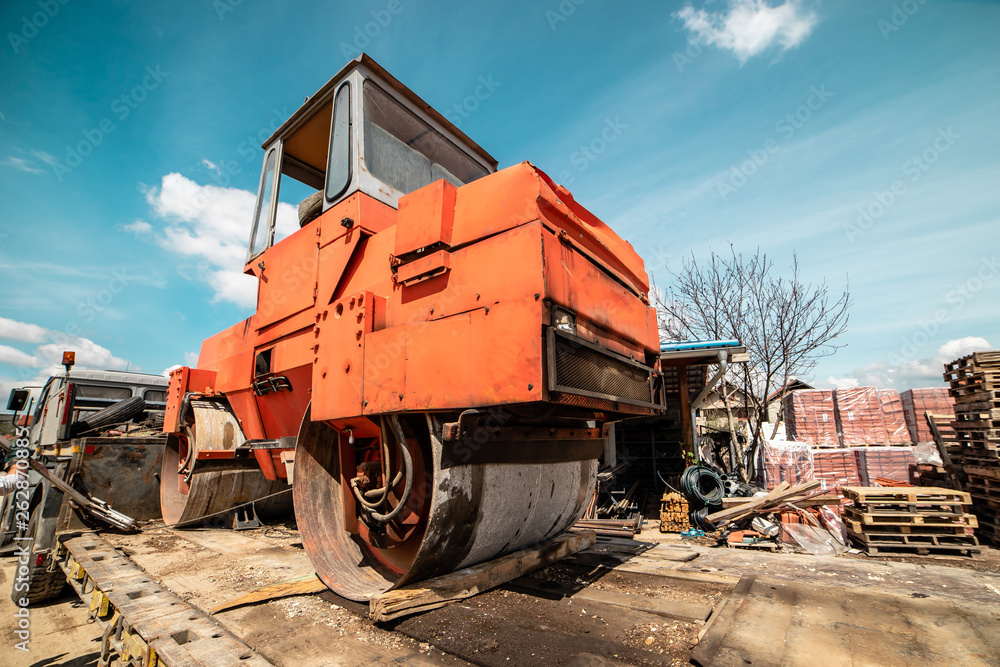 Heavy vibration red road roller compactor on the transport trailer truck Heavy vibration red road roller compactor on the transport trailer truck