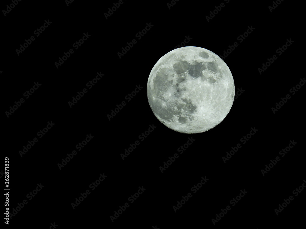 Fototapeta premium a full moon in the starry night sky