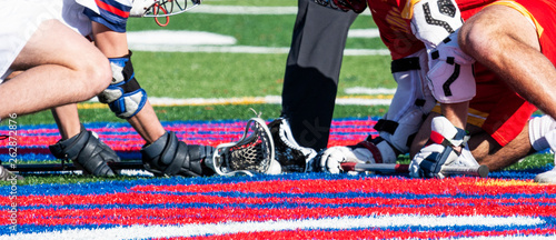 Close up of sticks and ball during lacrosse faceoff photo