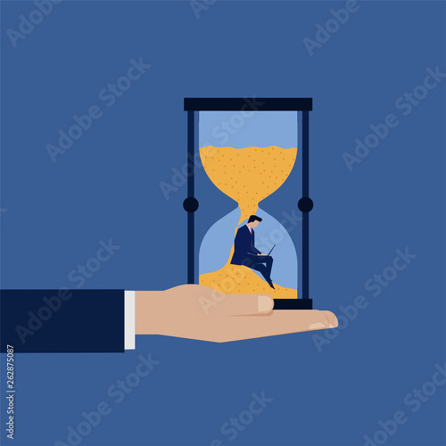 Businessman work on the sand time deadline.