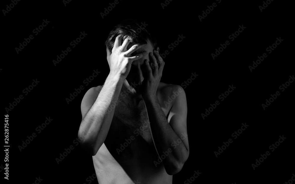 dramatic black and white photography, a man holding his head, in an ...