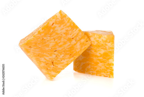 Marble cheese on a white background. Two triangles of cheese close up.
