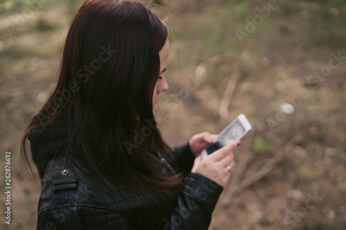 woman use of mobile phone at outdoor.