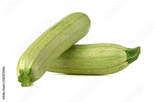 Courgettes on a white background. Green fresh zucchini close up.