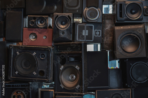 Wall of vintage loudspeakers, background. Low key filtered
