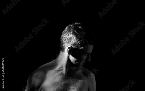 фотографія dramatic black and white photo, the man turned away from the camera