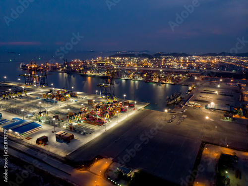 Aerial view At Night, harbor by crane, international water transport.
