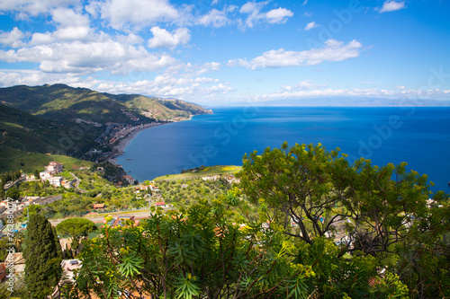 Fototapeta Naklejka Na Ścianę i Meble -  Mediterranean sea panoramic view. Beautiful blue crystal water and bright blue summer sky. Travel destination, Sicily island, Italy. 