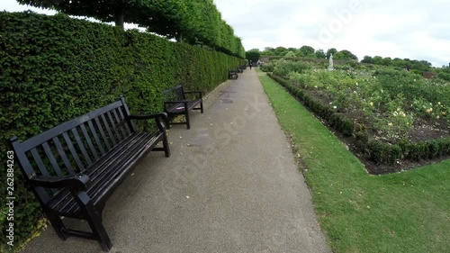 Tourist POV walking in the formal garden in Hapton Court Palace in Kingston, London