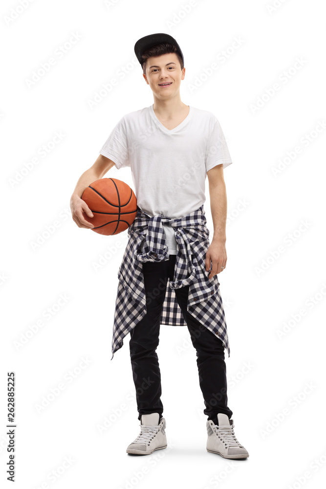 Male teenager posing with a basketball