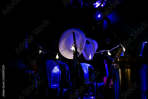 White hat, musical instrument, blue shadows and other sizes dark background.