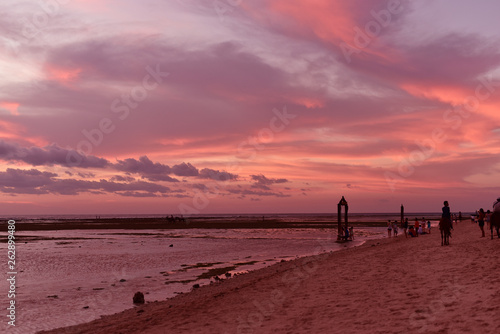 Tourists enjoy a spectacular sunset on the island of Gili Trawangan Lombok Indonesia