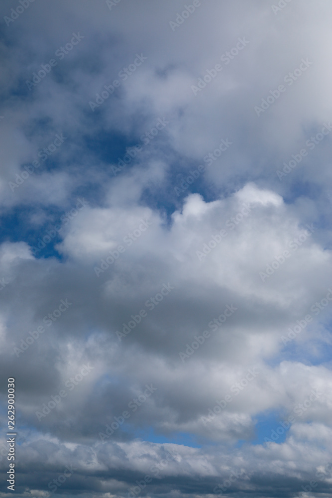 blue sky with grey and white clouds portrait orientation blue sky with grey and white clouds portrait orientation