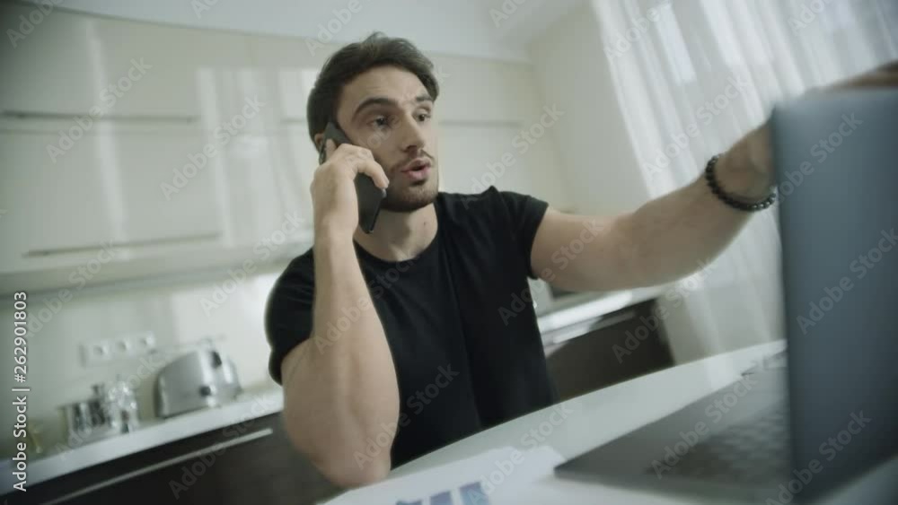 Business man talking phone at home. Startup owner call telephone at home Business man talking phone at home. Startup owner call telephone at home