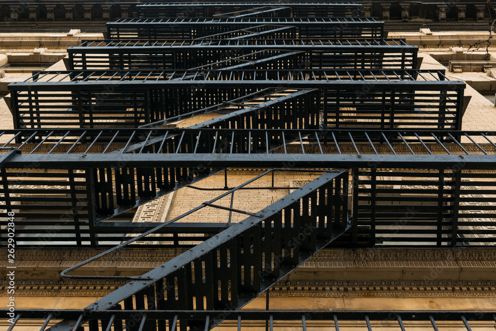 Oldfashioned castiron fire escape on the outside of an apartment