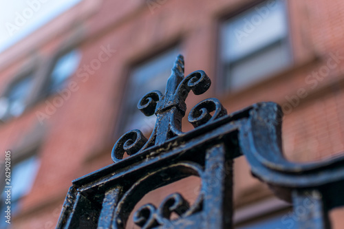 Detail on a wrought iron gate in New York City's Harlem neighborhood, Manhattan, NYC, USA
