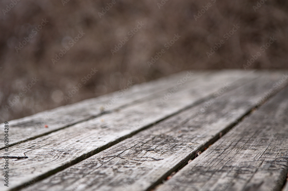 A carved table beside a small lake A carved table beside a small lake