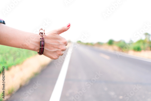Hand waving roadside cars