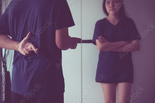 Lie husband with hand crossing fingers behind back telling liar and cheating to wife,April Fools' Day concept